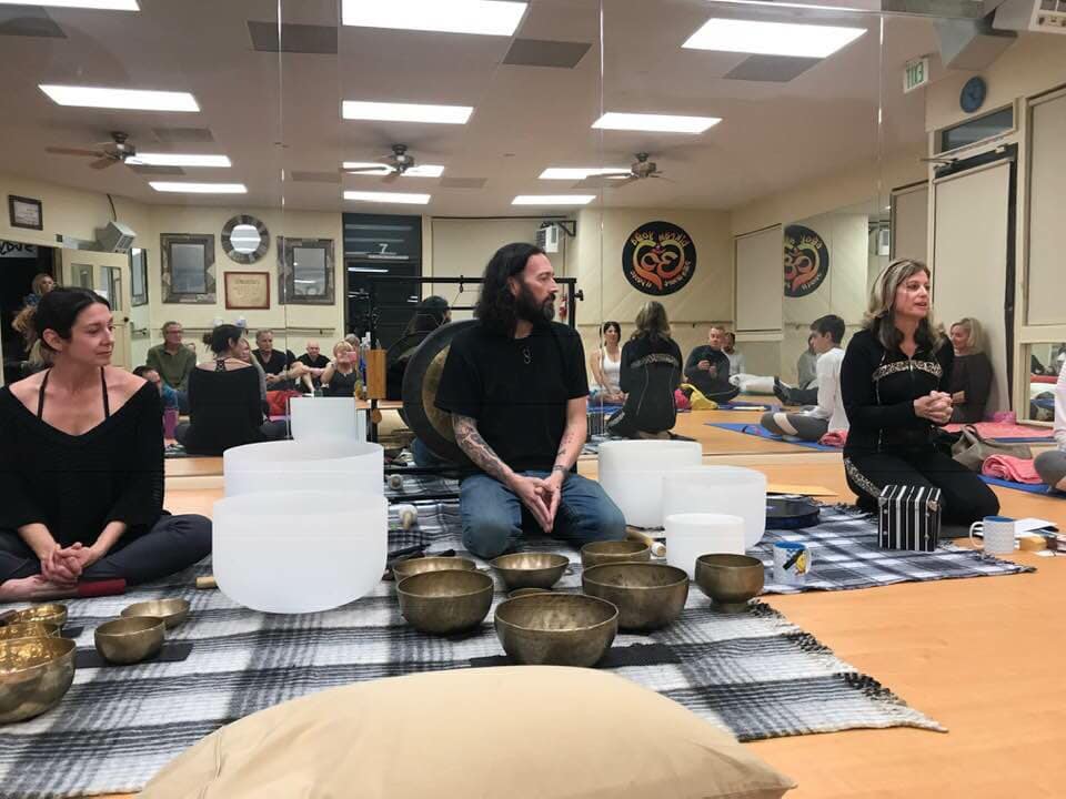 Sound healing and meditation session with crystal singing bowls at Bikram Yoga El Paseo.