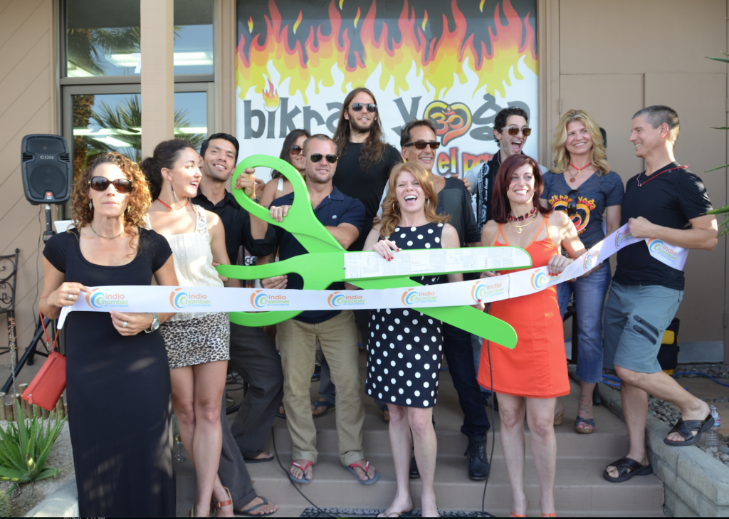 Grand opening ribbon cutting event with students and teachers at Bikram Yoga El Paseo Palm Desert studio.